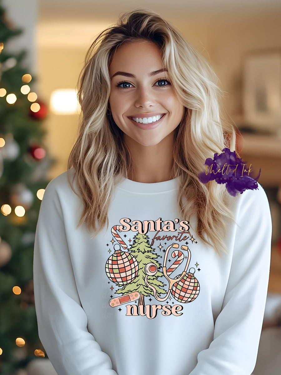 Photo is a mock up of design. Design is colored light pinks and light green and says Santa's Favorite nurse. Has picture of a christmas tree, ornaments, candy cane, stethascope and bandaid.