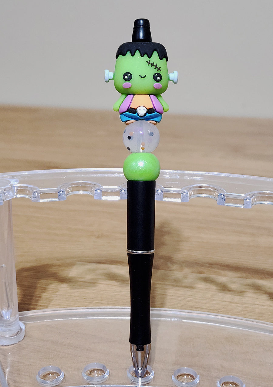 3D Frankenstein beadable ink pen with unique beaded design. Perfect for Halloween fans, horror lovers, and collectors. A fun, customizable writing tool featuring Frankenstein's monster, ideal for novelty gifts, spooky stationery, and personalized pens.