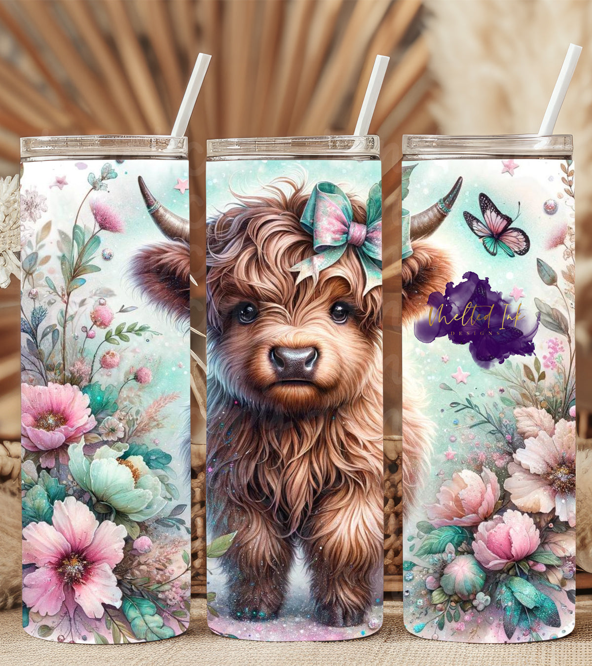 Highland cow tumbler featuring a colorful design with flowers and butterflies, perfect for Highland cow lovers and nature enthusiasts. Ideal for everyday use or as a gift for fans of farm animals and whimsical drinkware.
