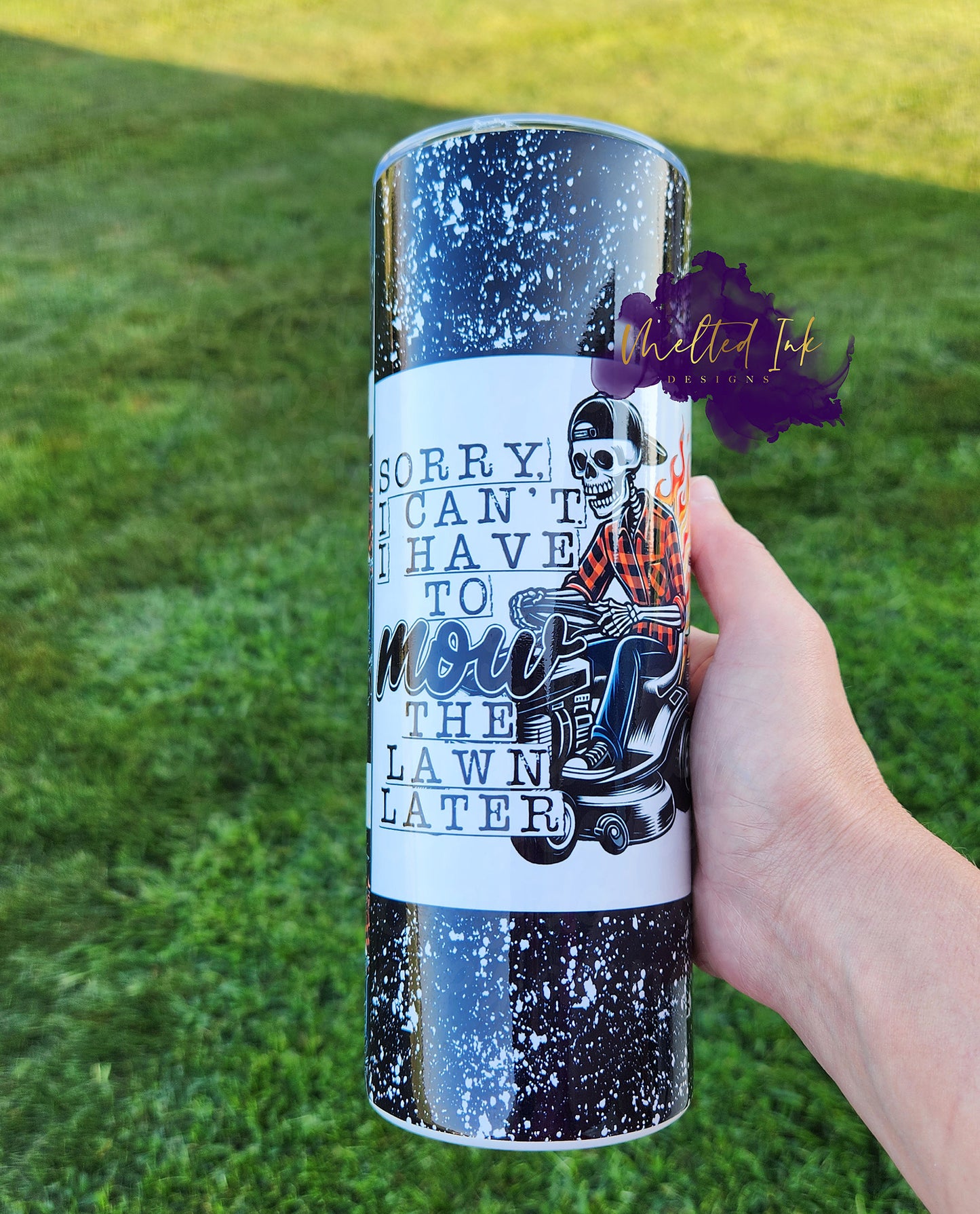 Photo is a 20oz tumbler with a skeleton riding a lawnmower that says sorry i cant i have to mow the lawn later.