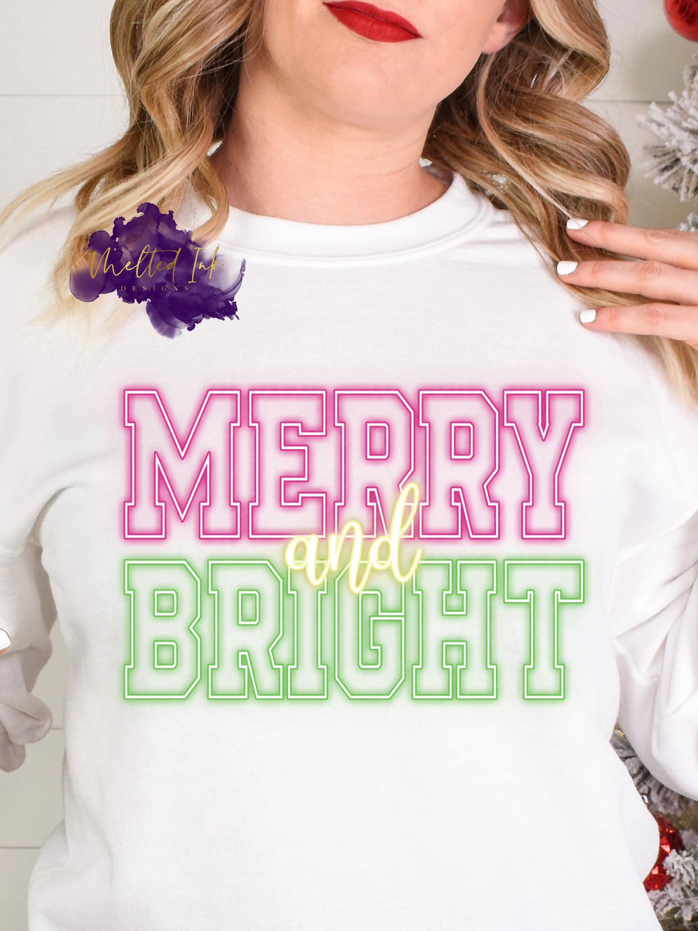Photo is a mock up of the design and says Merry & Bright in neon color of pink and green.