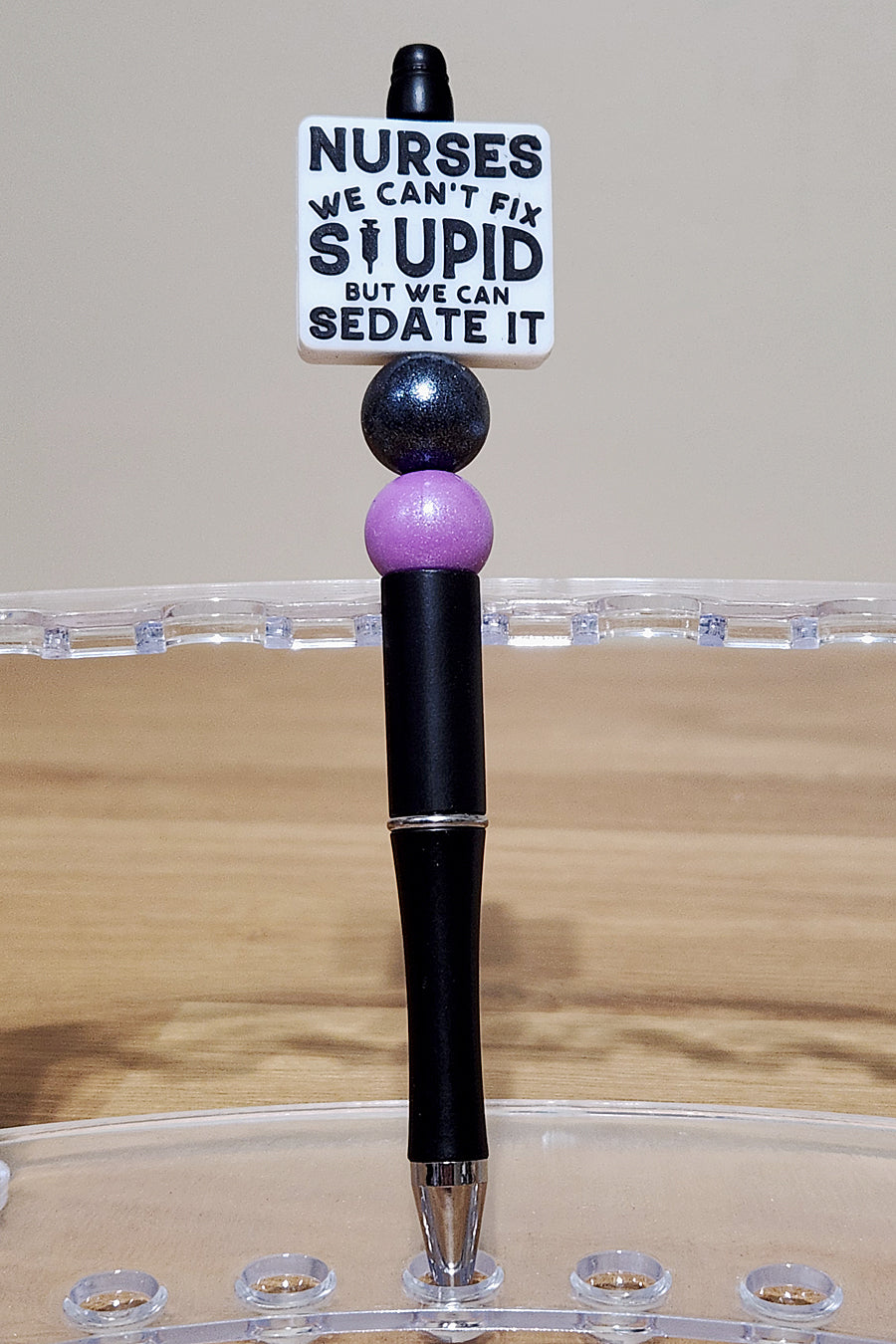 Funny nurse beadable ink pen with 'We Can't Fix Stupid' quote, perfect for medical professionals. Customizable and stylish nurse pen gift for coworkers, nurses, and healthcare workers who love humor and personality in their accessories.