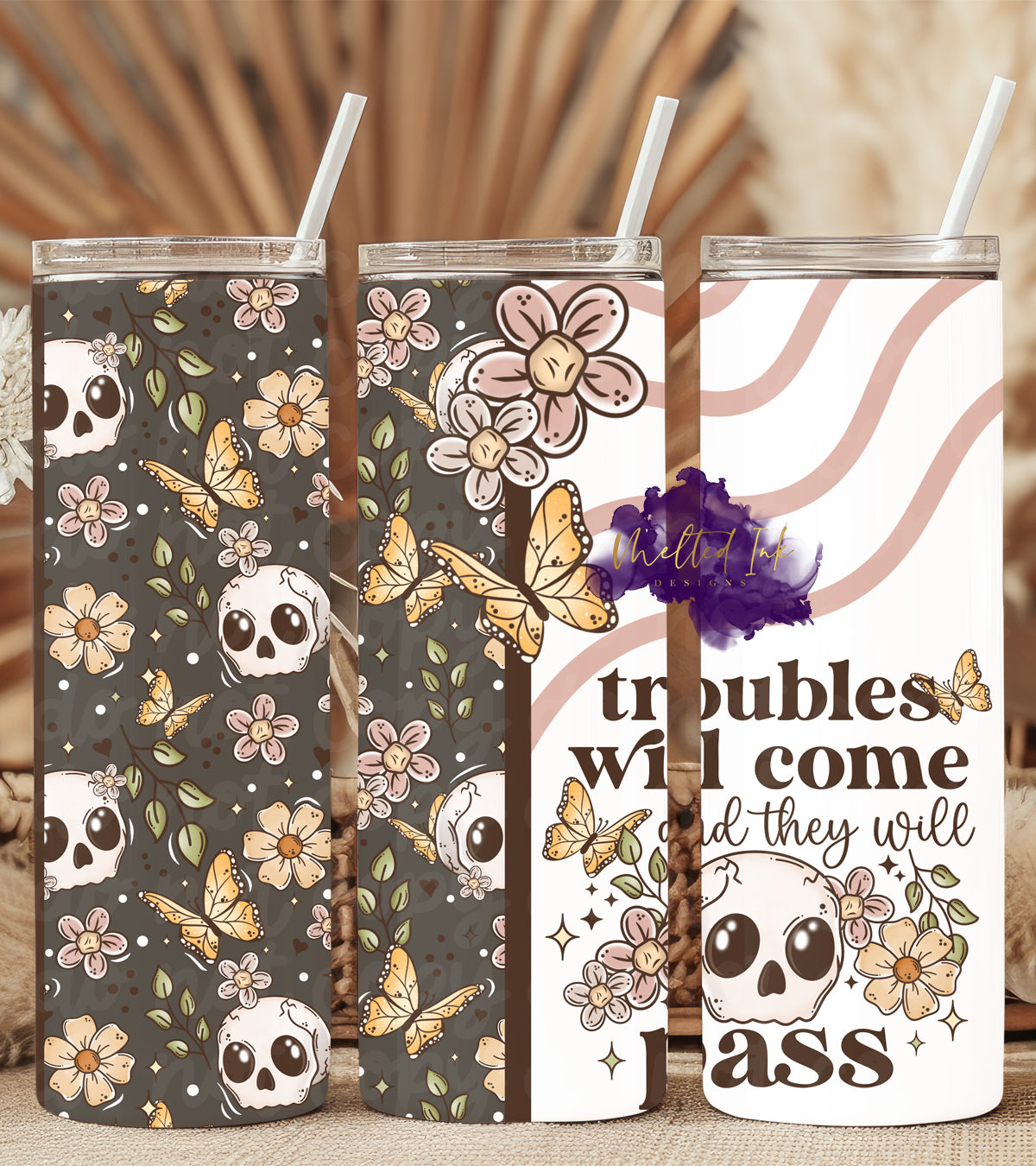 Motivational tumbler with the quote 'Troubles Will Come and They Will Pass,' featuring a unique design of flowers, butterflies, and skulls. Perfect for everyday use, this tumbler is ideal for those who appreciate bold, nature-inspired drinkware with empowering messages.