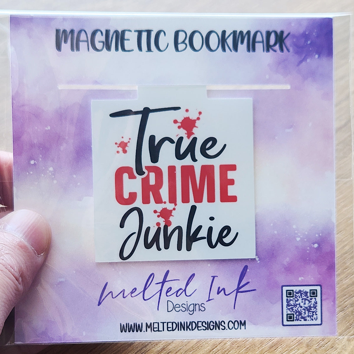 This magnetic bookmark boldly proclaims "True Crime Junkie," complete with eye-catching blood splatters that enhance its edgy theme.
