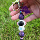 The photo features a beadable keychain bar that prominently displays an astronaut focal bead in the center. Above and below the astronaut, there are galaxy focal beads, likely adorned with vivid colors and cosmic designs that enhance the space theme.