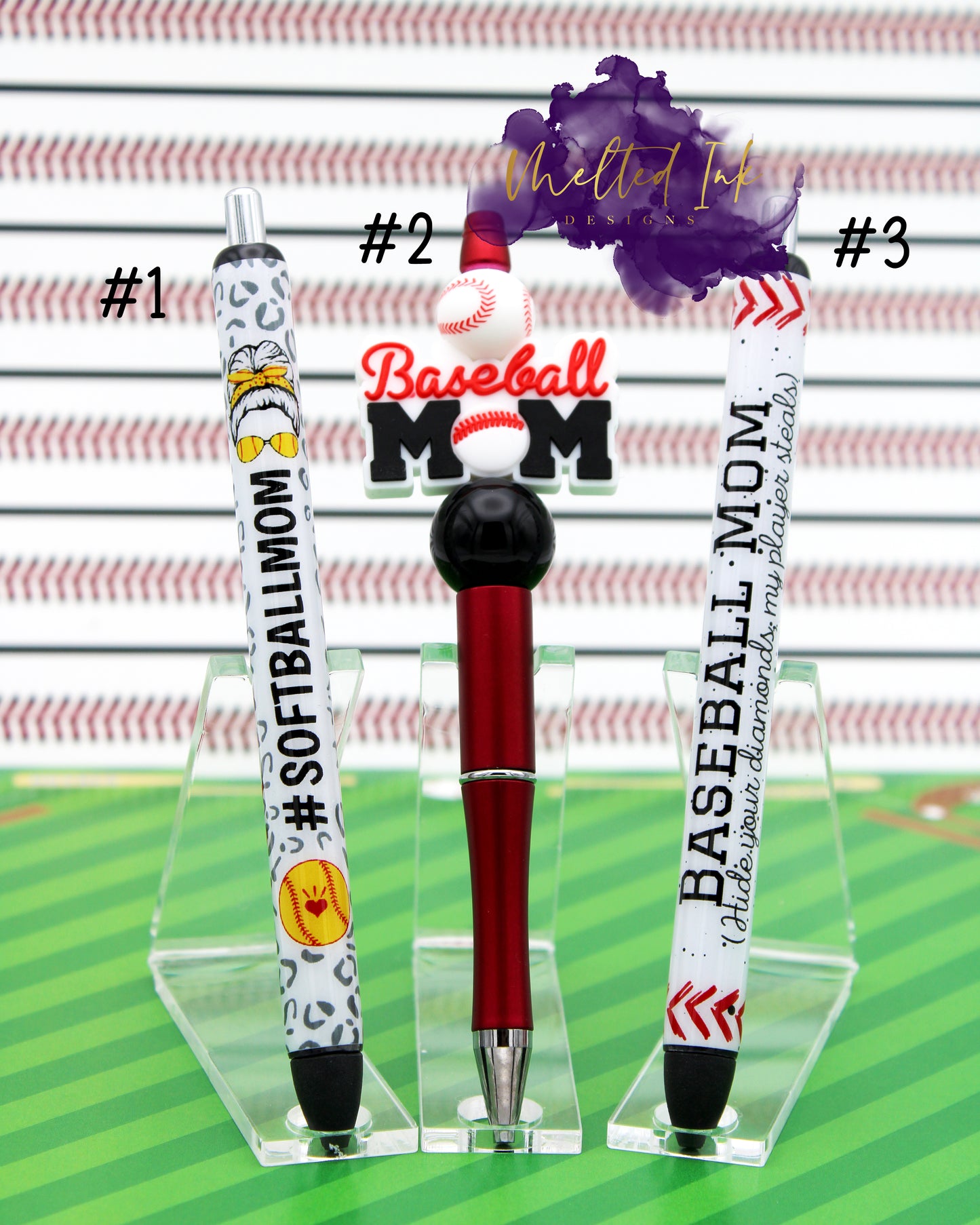 Photo shows 3 different ink pens. 
#1 shows an epoxy vinyl wrapped pen that has a gray leopard print background and says #softballmom with a softball on it. #2 has a beadable ink pen that has a baseball mom focal bead and a baseball print silicone bead and a solid black acrylic bead. These are on a red pen base. #3 is an epoxy vinyl pen wrap that says baseball mom hide your diamonds my player steals. All 3 pens come with black ink. 