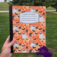 Composition notebook with cute ghost, pumpkin, and floral design. Pen not included.