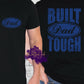 T-shirt with blue “Dad” logo on the front and bold “Built Dad Tough” text graphic on the back, perfect for Father’s Day, dad gifts, or everyday dad apparel.