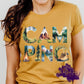 Shirt design with the word “CAMPING” in bold letters, each filled with scenic outdoor illustrations including pine trees, mountains, a tent, a campfire, and a hiking boot. A nature and adventure themed design perfect for shirts, hoodies, and sweatshirts.