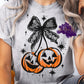 Shirt design featuring halloween-themed design featuring pumpkins and a black lace bow.