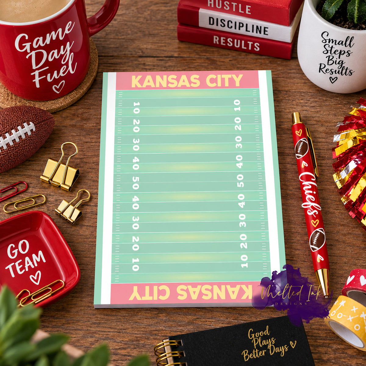 A Kansas City notepad showing a football field. Each end zone says Kansas City. 