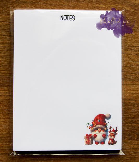 Photo is of a 4.25x5.5 notepad that says notes at the top with a Christmas Gnome on the bottom corner. 