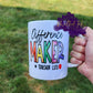 Photo is of a 15 oz mug that says Difference Maker #Teacherlife. Design printed on both sides. 