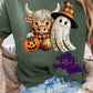 Cute highland cow in a plaid pattern holding a pumpkin, next to a smiling ghost with floral embroidery and a plaid witch hat. The design uses warm fall colors with cozy stitched textures.