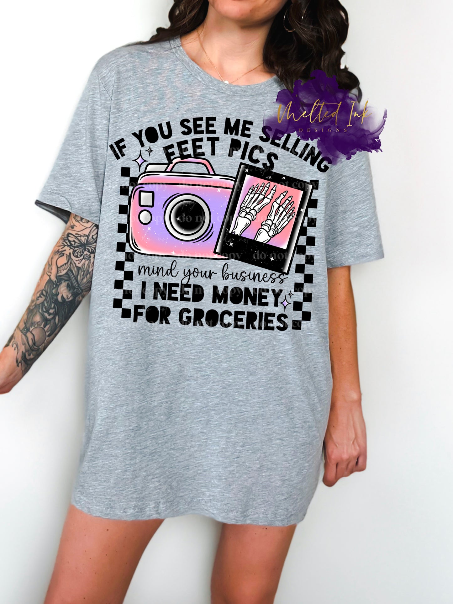 Picture if a mock up and is on a grey shirt. Shirt says If you see me selling feet pics mind your business I need groceries. 