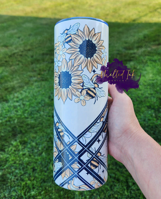 Photo is a 20oz tumbler that consists of sunflowers and bees design. 