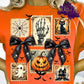 Design features stamp style frames with a skeleton hand, pumpkin, black cat, haunted house, cobweb, and cute ghost. Two black lace bows with skull patterns and small flying bats decorate the layout.