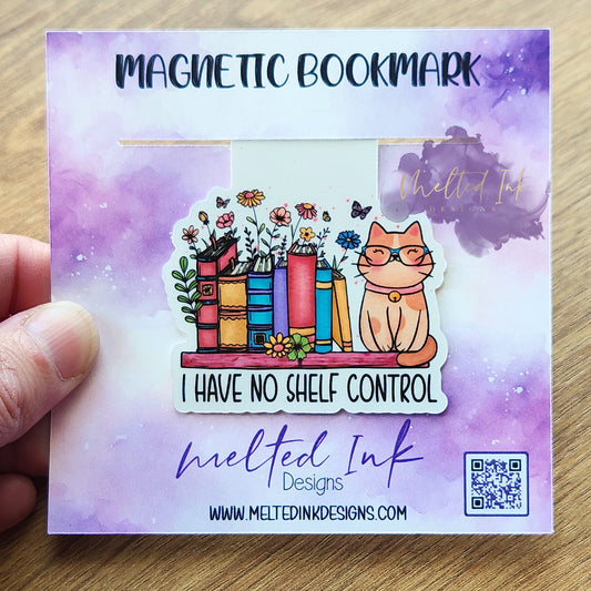 This magnetic bookmark features the humorous phrase "I Have No Shelf Control." It showcases a delightful scene with a group of books lined up side by side, along with a cat comfortably resting on the shelf among the books