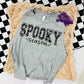 Photo is a mock up of the design.  Design is a black print pressed on a gray shirt. Design says Spooky Season. The word spooky has a bat background inside of them. 
