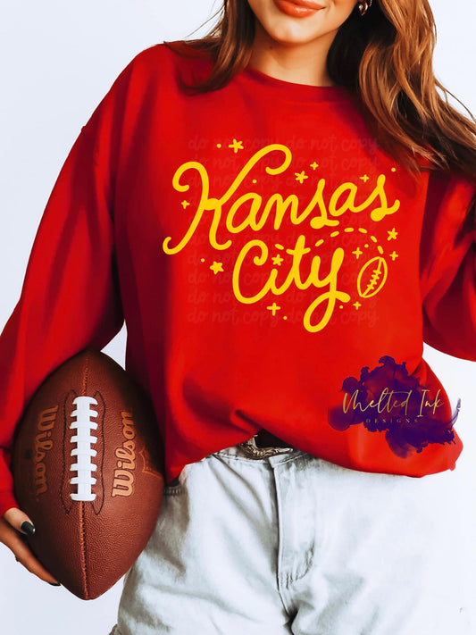 Photo is a mock up of design. Design is colored golden yellow and says Kansas City. Includes a little football on the design. 