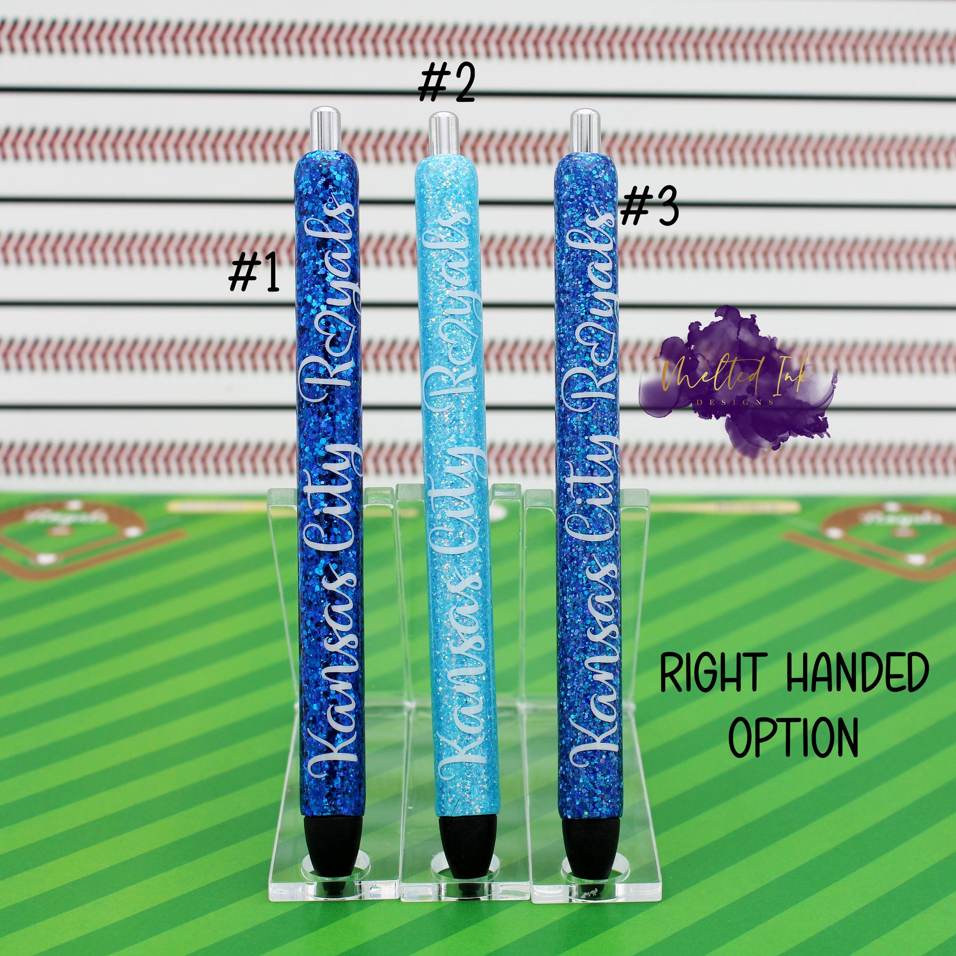 Photo consists of 3 epoxy glitter pens. #1 is a dark blue glitter, #2 has light tiffany blue glitter and #3 has a blue glitter. All there have the words Kansas City Royals. Comes in left or right handed options and they come with black ink. 