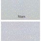 Two holographic laminate options featuring a star pattern and a dot pattern. Each laminate adds a shimmering, reflective finish.