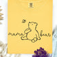 "Charming line art of a gentle bear admiring a butterfly, beautifully paired with the script phrase 'mama bear' to celebrate the love and strength of motherhood."