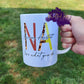 Photo is of a 15oz mug that says NA Nursing Assistant love what you do. 