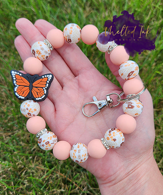 Orange Monarch Butterfly & Floral Wristlet