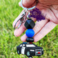 photo is a silver beadable keychain bar that consists of alternating black and blue solid silicone beads above a police cruiser focal bead. 