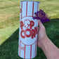 Photo consists of a 20oz tumbler that says Fresh Popcorn Delicious. 
