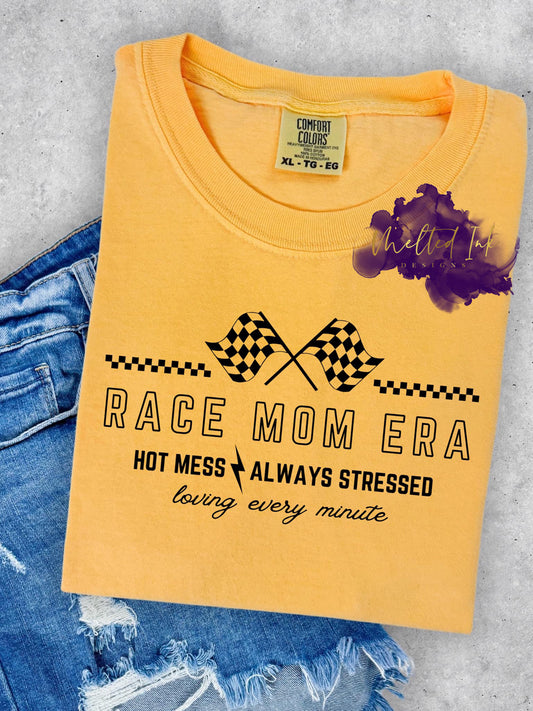 Mom Era T-shirt with checkered flag design and text “Hot Mess Always Stressed Loving Every Minute”