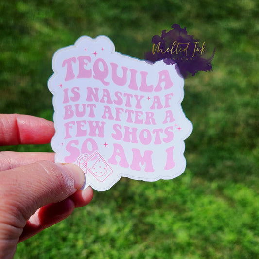 Photo is of a sticker that says Tequila is nasty af but after a few shots so am I. Ink is pink