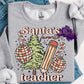 Photo is a mock up of design. Design is colored light pinks and light green and says Santa's Favorite teacher. Has picture of a christmas tree, ornaments, candy cane, and pencil. 