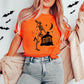 Photo is a mock up of the design.  Design is black in color and is pressed on an orange shirt. Design is of a skeleton holding a trash bag. The words on the trash bag read opinions on how I'm supposed to live my life. 