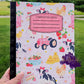 Farm-themed composition notebook featuring cows with bows, chickens, strawberries, flowers, pink rain boots, hay bales, and a vintage tractor on a light pink background with a customizable label area.