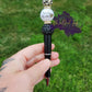 Photo is a black beaded ink pen that has an acrylic bead that says social worker with a leopard print heart. Accenting the acrylic bead is a leopard print silicone bead and a plane black acrylic bead. Also has a rhinestone spacer. Ink is black. 